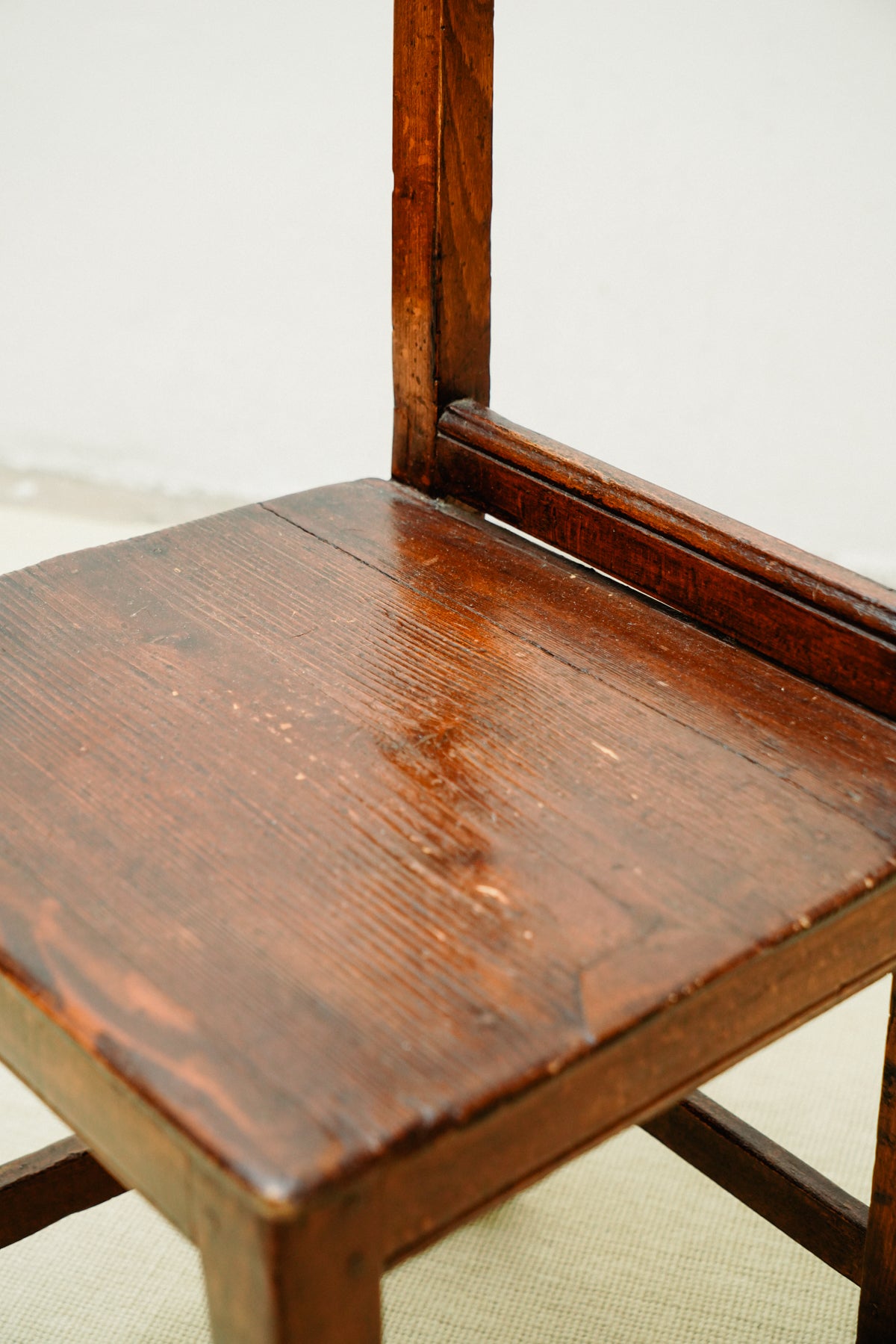 Small wooden chairs with high back rest
