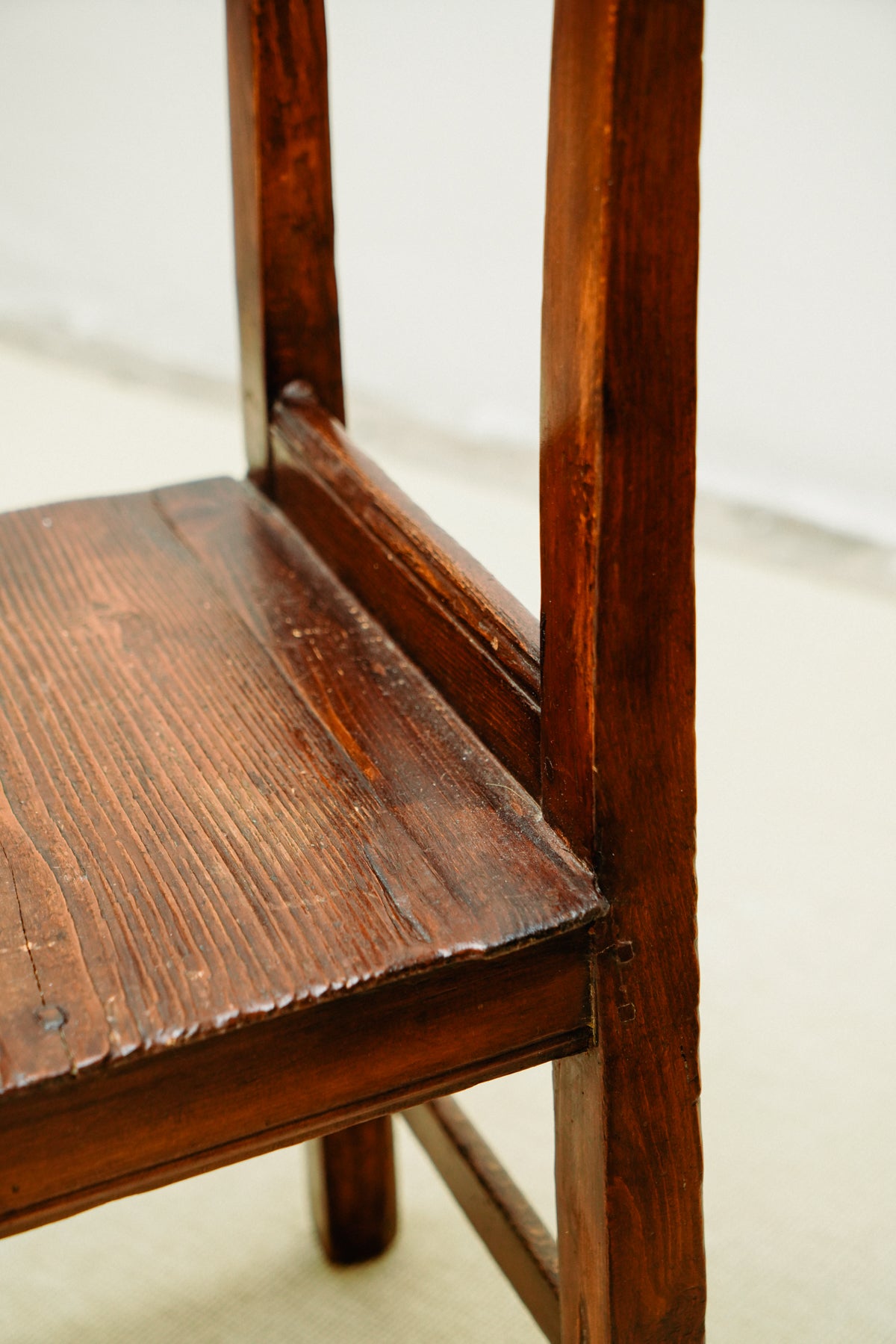 Small wooden chairs with high back rest
