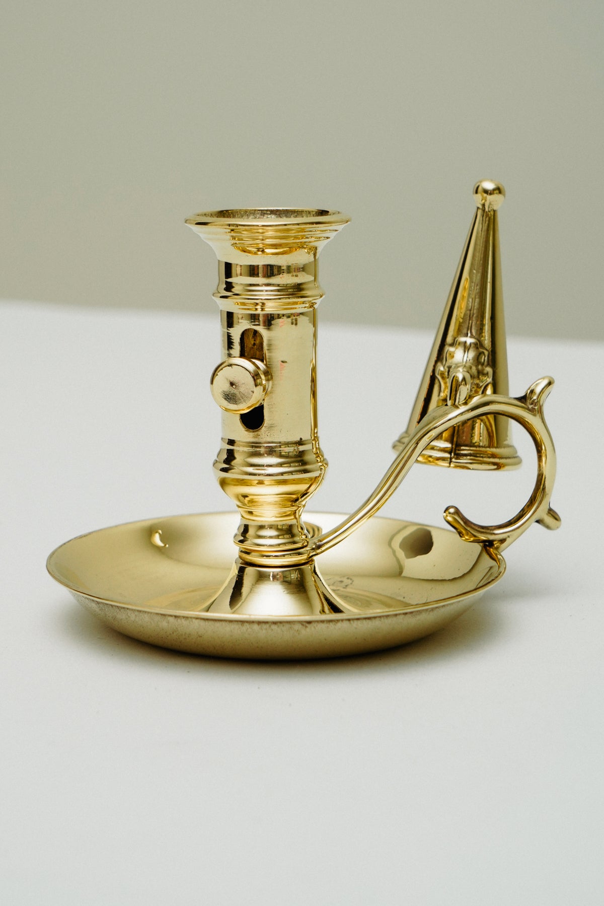 Brass candleholder with candle snuffer