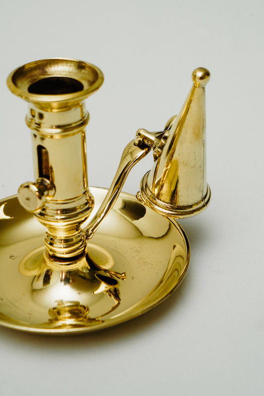 Brass candleholder with candle snuffer
