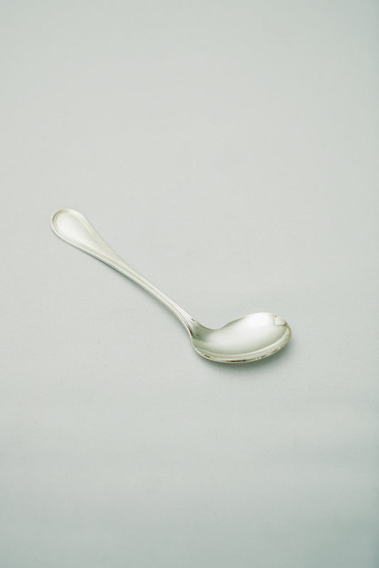 Curved baby spoon