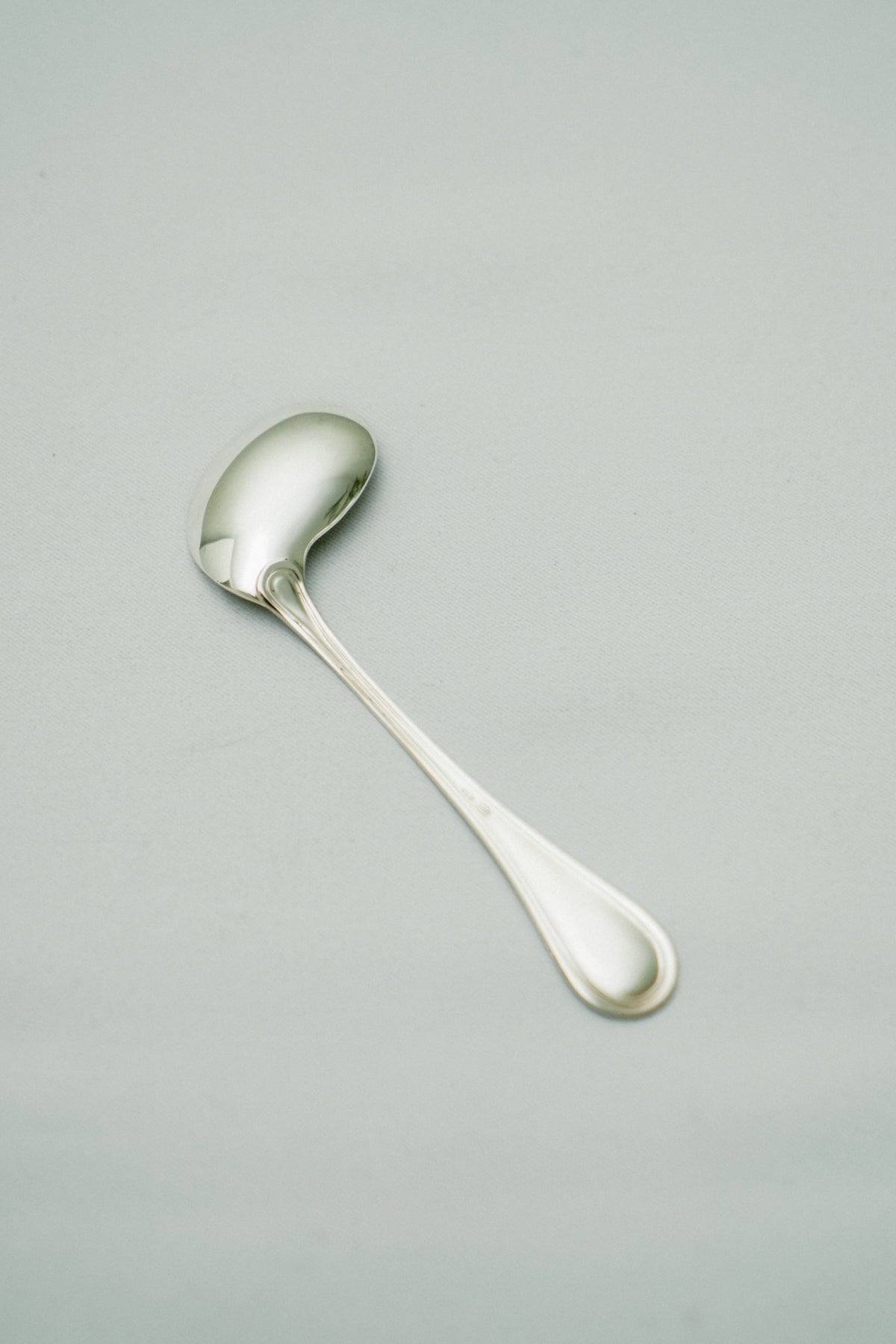 Curved baby spoon