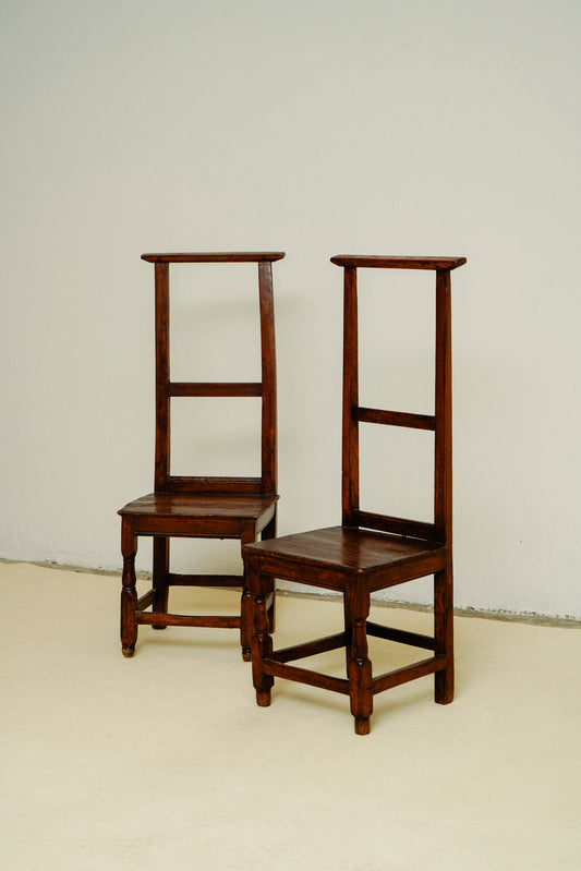 Small wooden chairs with high back rest