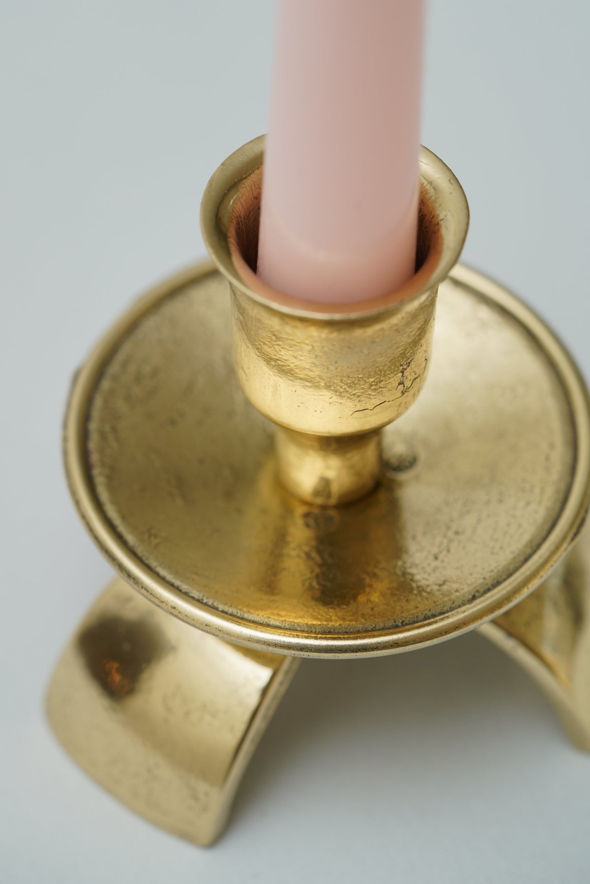 Three legged brass candle holder