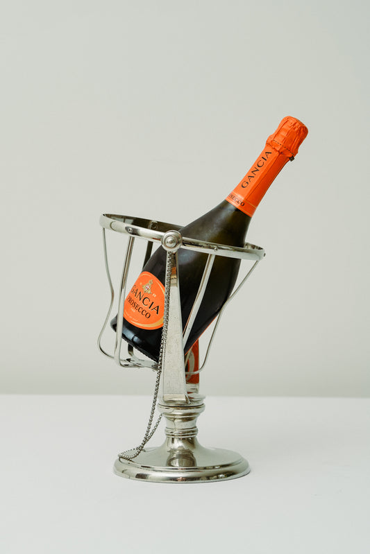 Swinging bottle holder