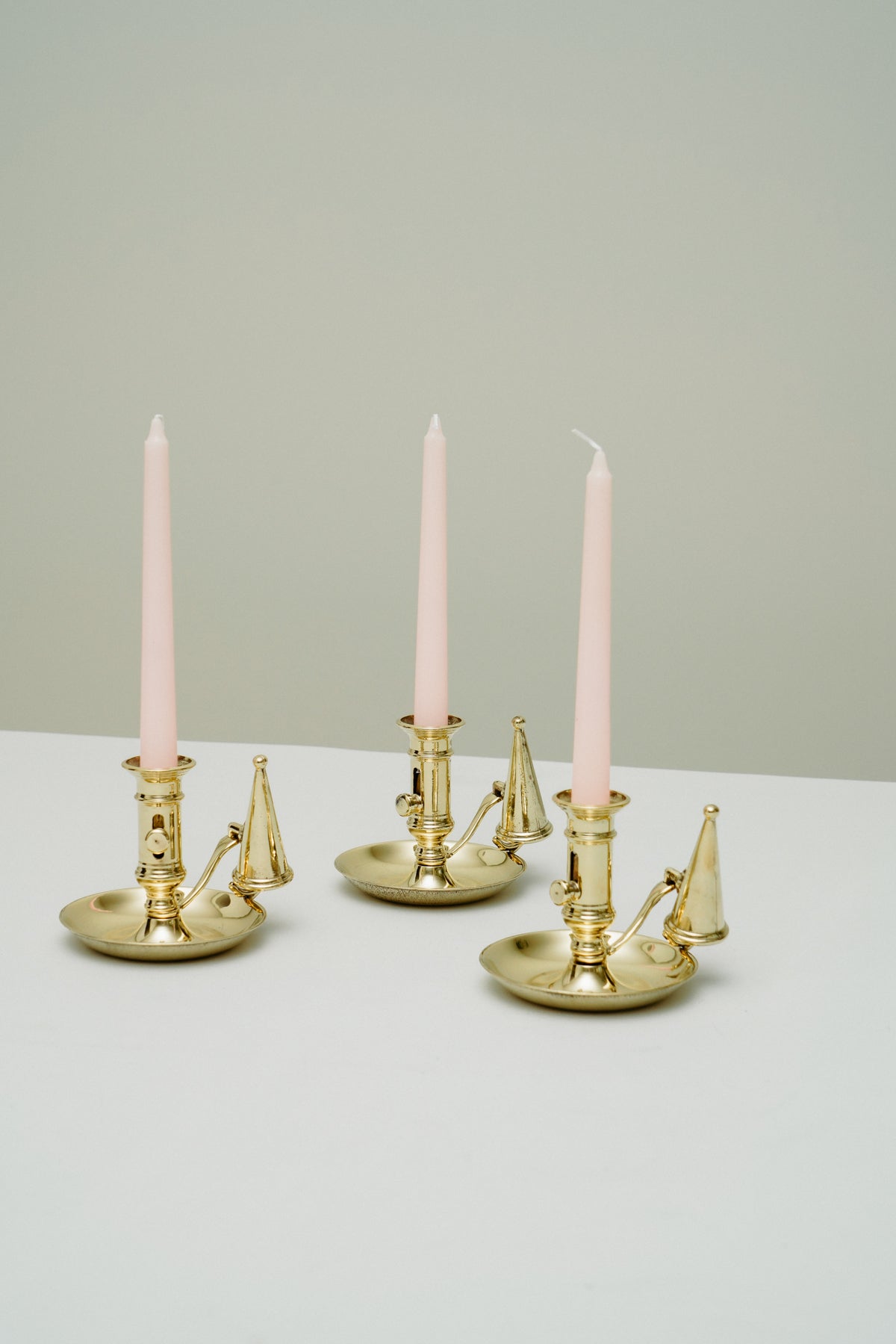 Brass candleholder with candle snuffer
