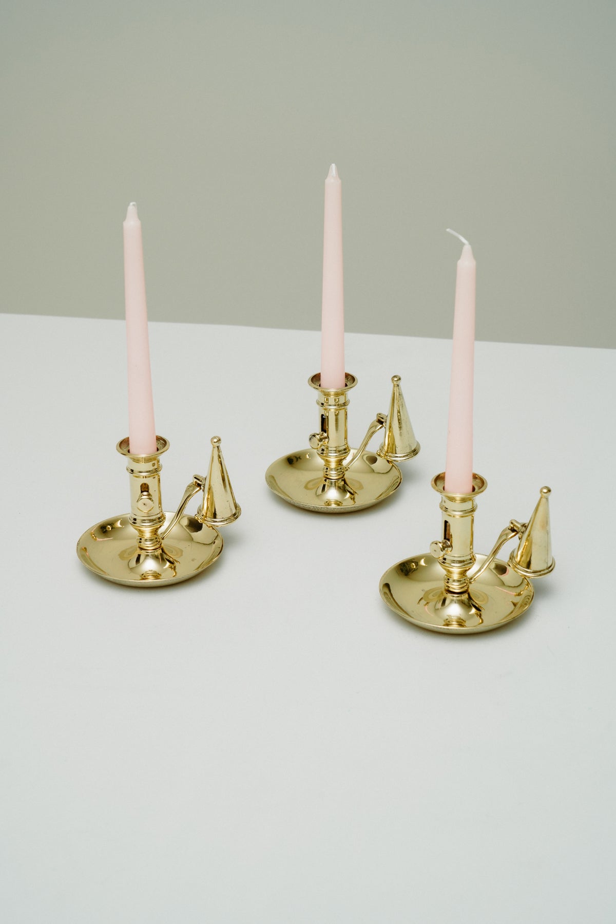 Brass candleholder with candle snuffer