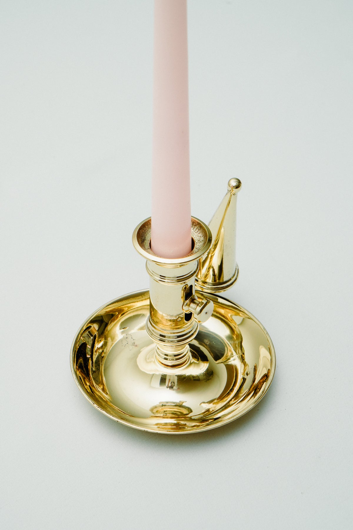 Brass candleholder with candle snuffer