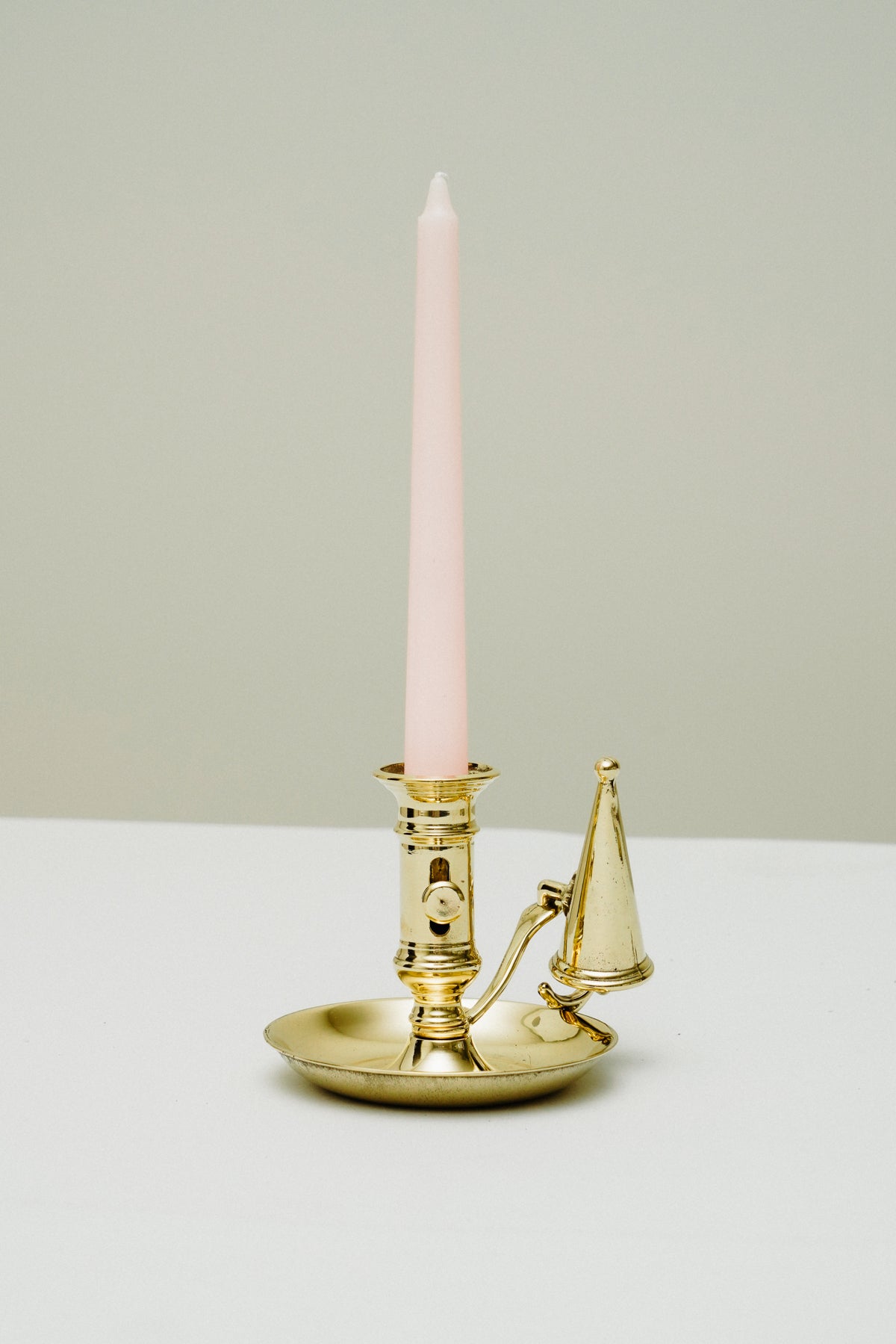 Brass candleholder with candle snuffer