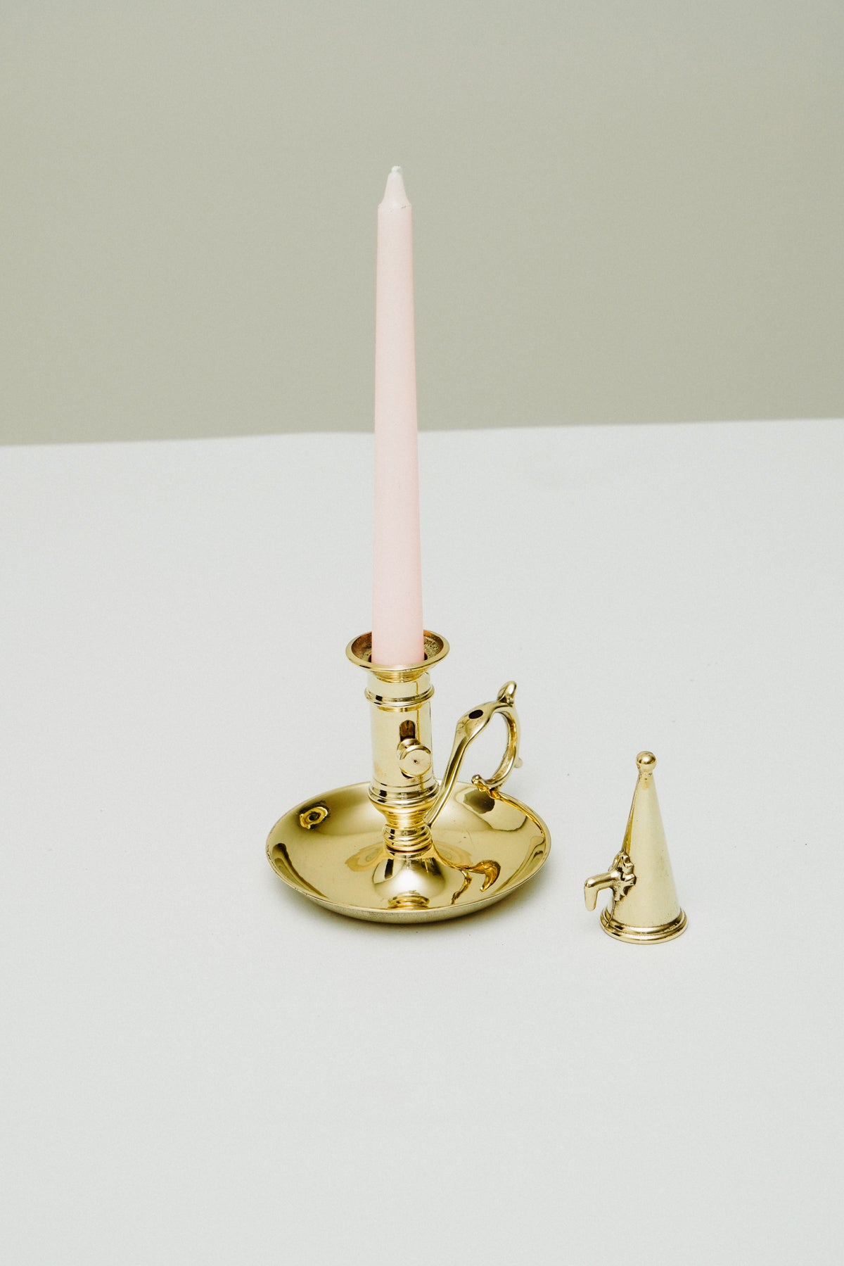 Brass candleholder with candle snuffer