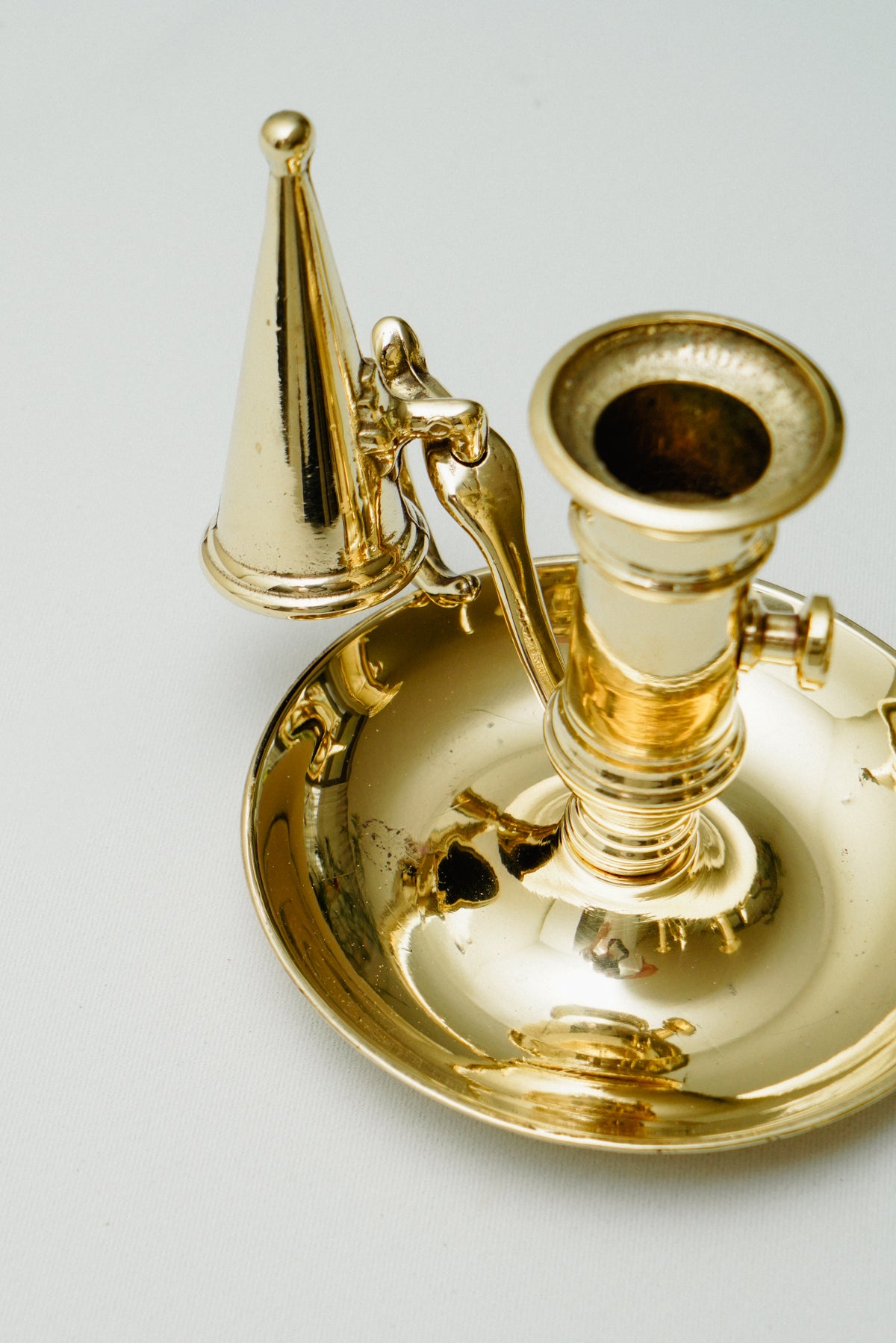 Brass candleholder with candle snuffer