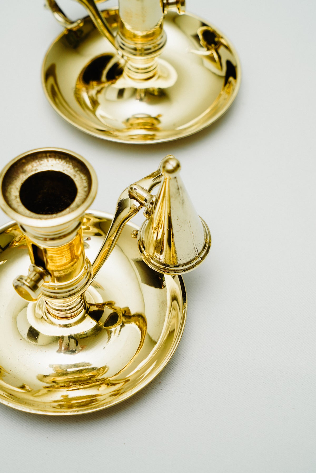 Brass candleholder with candle snuffer