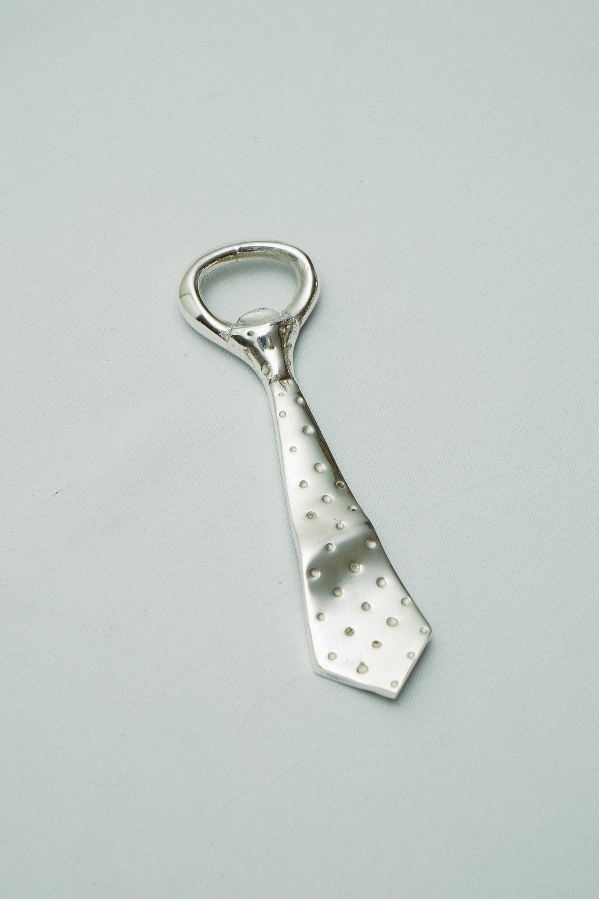Tie bottle opener