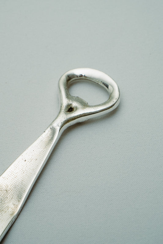 Tie bottle opener