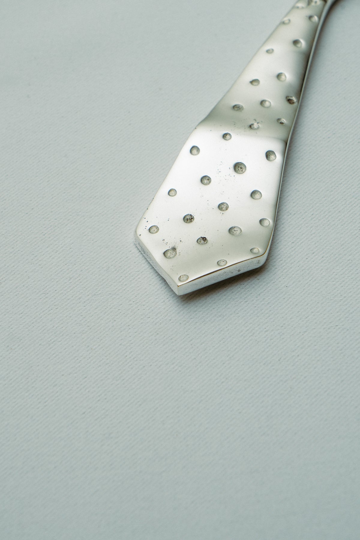 Tie bottle opener