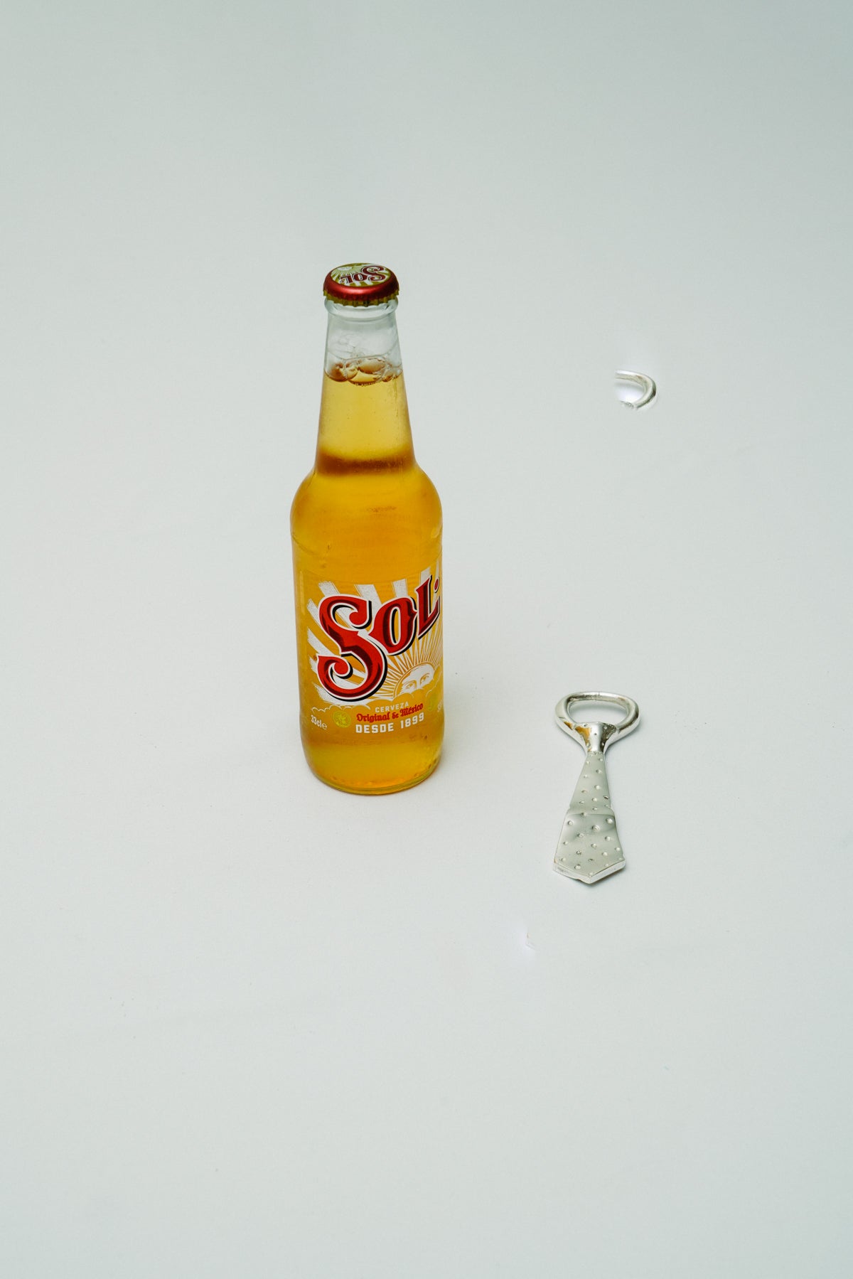 Tie bottle opener