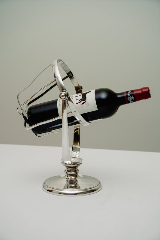 Swinging bottle holder