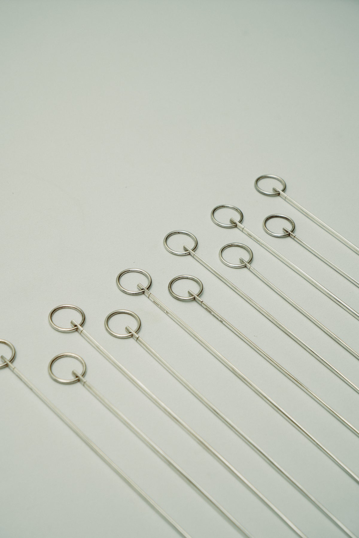 Set of 11 Christofle skewers with hanging loop
