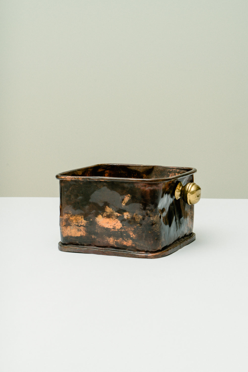 Copper box with brass knobs