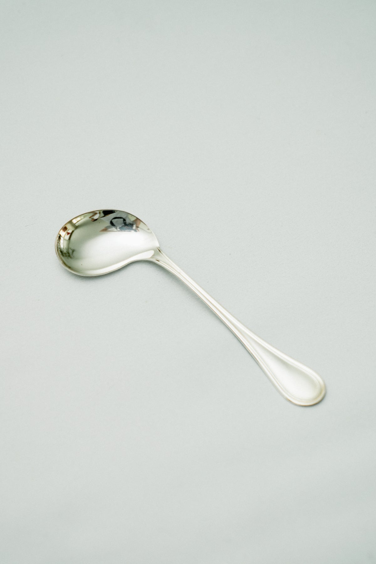 Curved baby spoon