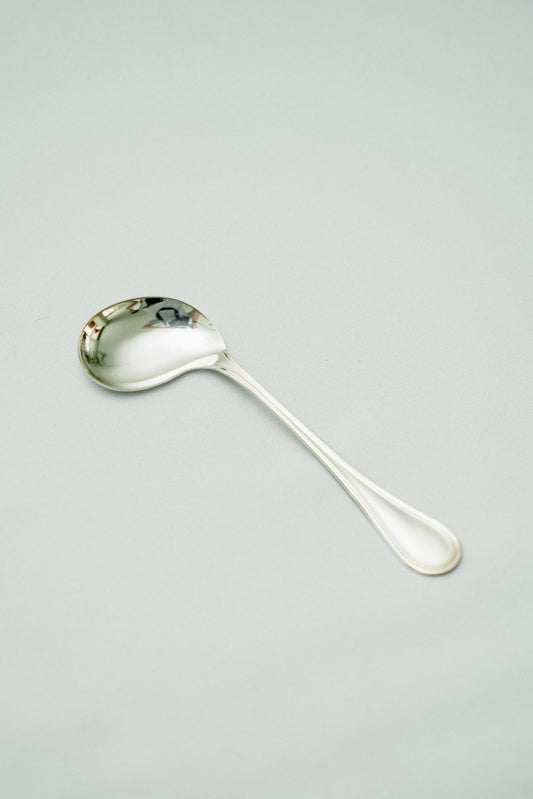 Curved baby spoon